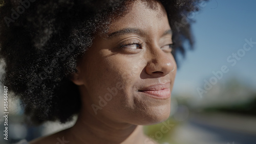 African american woman smiling confident looking to the side at park