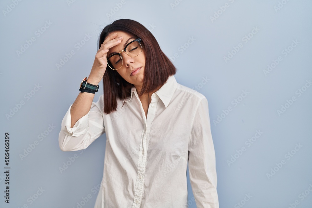 Young hispanic woman standing over white background worried and stressed about a problem with hand on forehead, nervous and anxious for crisis Young hispanic woman standing over white background worried and stressed about a problem with hand on forehead, nervous and anxious for crisis