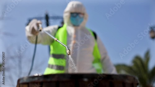 image of people spraying pesticides