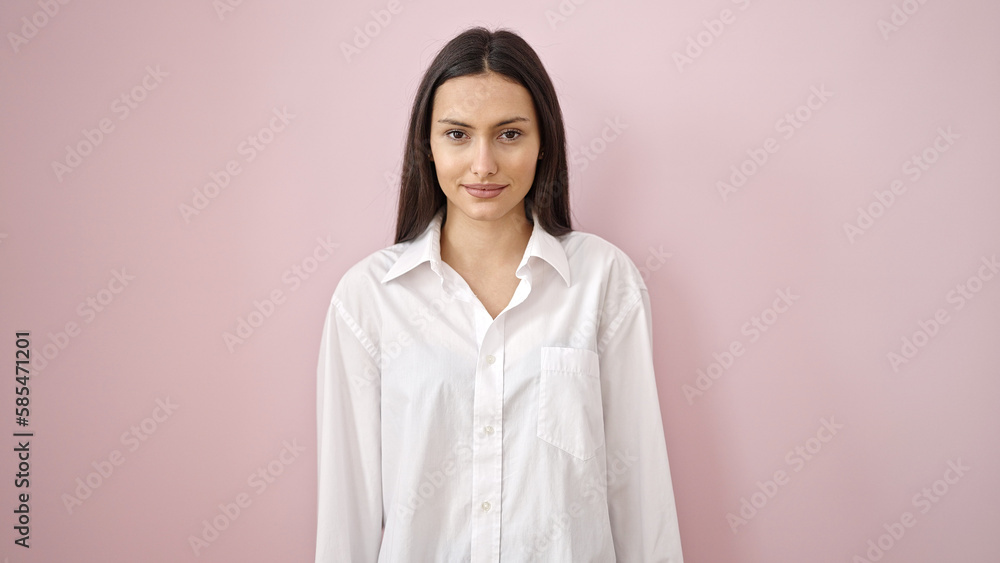 Young beautiful hispanic woman smiling confident standing over isolated pink background Young beautiful hispanic woman smiling confident standing over isolated pink background