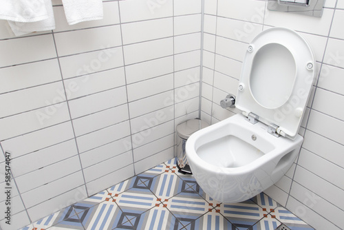 Floating toilet. Mounted toilet bowl in clean modern bathroom