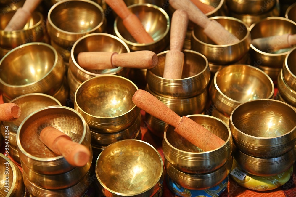 Bunch of piled Hinduist tibetan singing bowls for wellness practices Bunch of piled Hinduist tibetan singing bowls for wellness practices