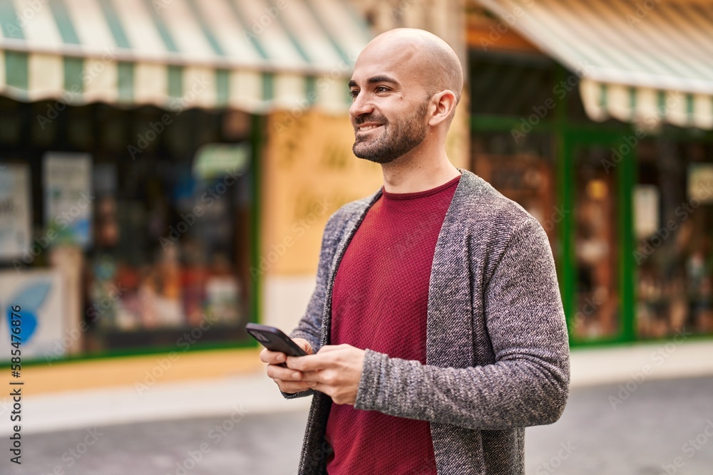 Young man smiling confident using smartphone at street Young man smiling confident using smartphone at street