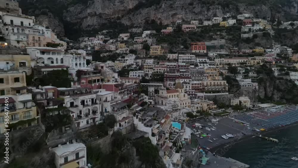 Aerial video of the colorful villas of Positano, on the cliff side with boats on the ocean, Italy Aerial video of the colorful villas of Positano, on the cliff side with boats on the ocean, Italy