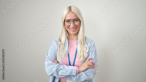 Young blonde woman wearing glasses standing with arms crossed gesture over isolated white background