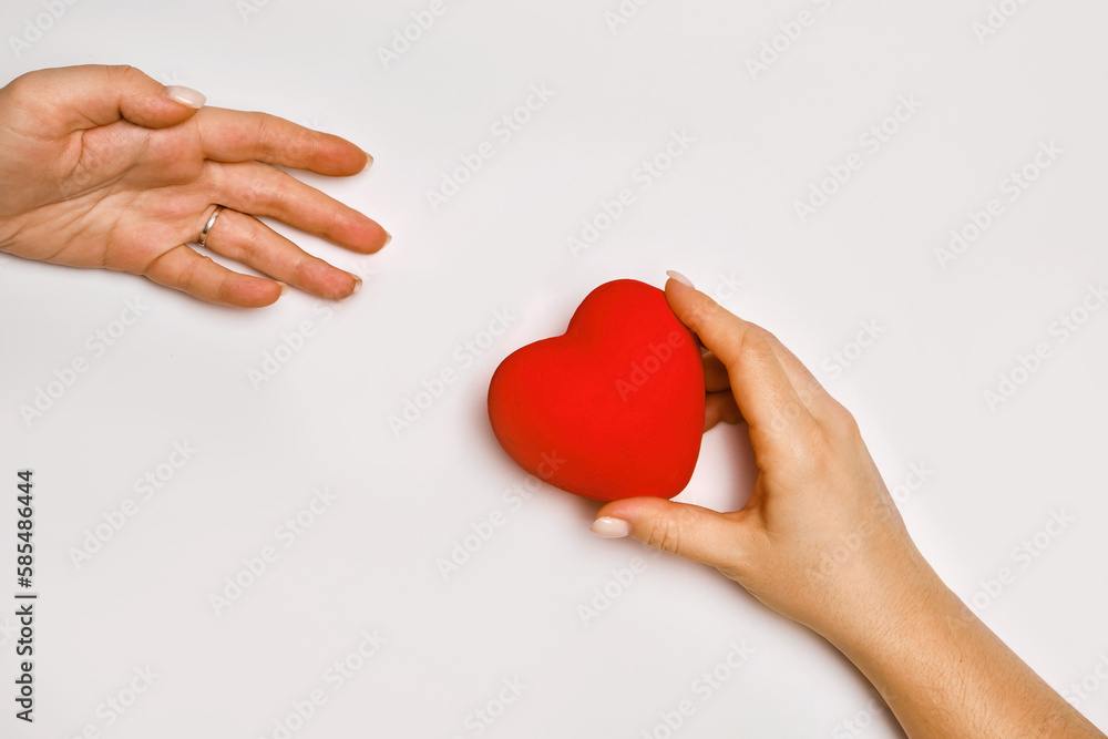 Obraz premium hands holding red heart, health care, love, organ donation, mindfulness, wellbeing, family insurance and CSR concept, world heart day, world health day, world mental health day, praying concept
