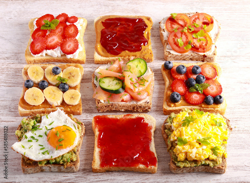 Selection of breakfast toasts with different toppings - savory and sweet.