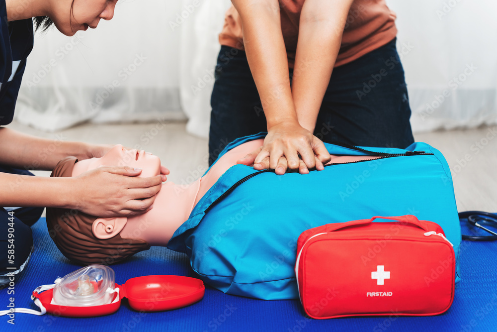 CPR Training ,Emergency and first aid class on cpr doll, Cardiopulmonary resuscitation, One part of the process resuscitation on unconscious person. - obrazy, fototapety, plakaty 