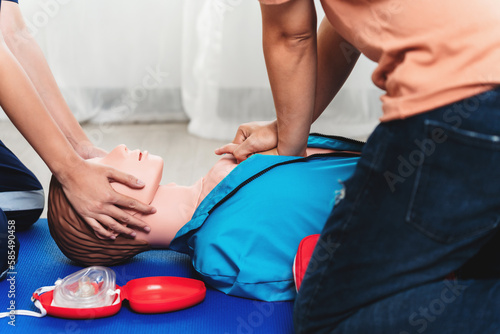 CPR Training ,Emergency and first aid class on cpr doll, Cardiopulmonary resuscitation, One part of the process resuscitation on unconscious person. photo