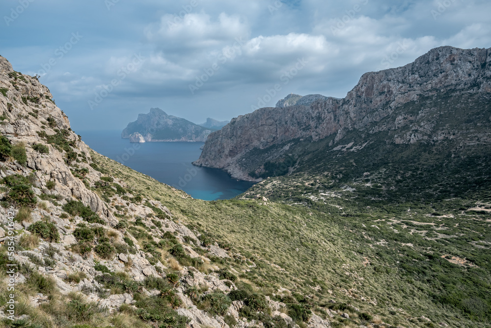 Serene valley nestled amidst majestic coastal cliffs in Mallorca