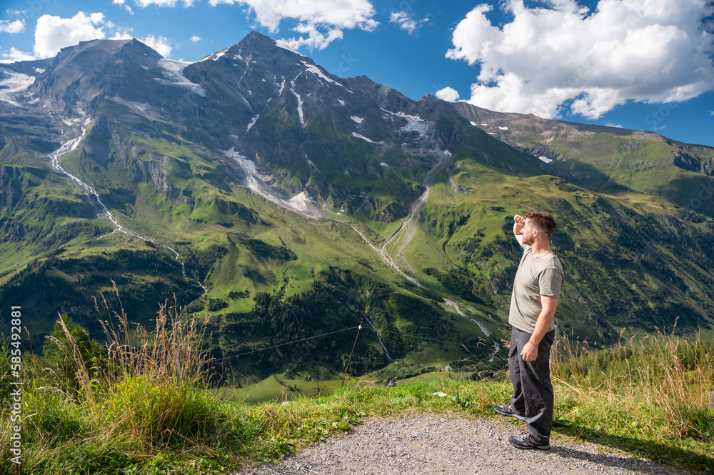 Young man hiking the Grossglockner High Alpine Road, High Tauern National Park, Austria. Austrian Alps, Kitzbühel Alps.
