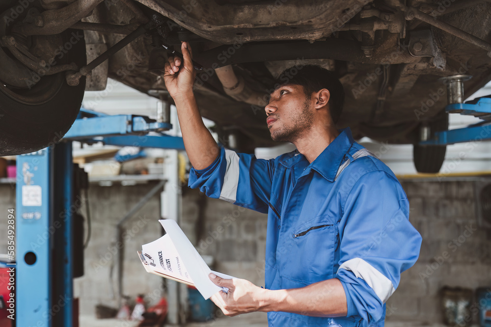 Expert auto mechanic repair and service customer service work on car at garage. automobile car concept Expert auto mechanic repair and service customer service work on car at garage. automobile car concept