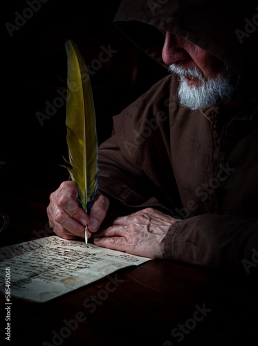 Old monk in the Middle Ages studies ancient writings