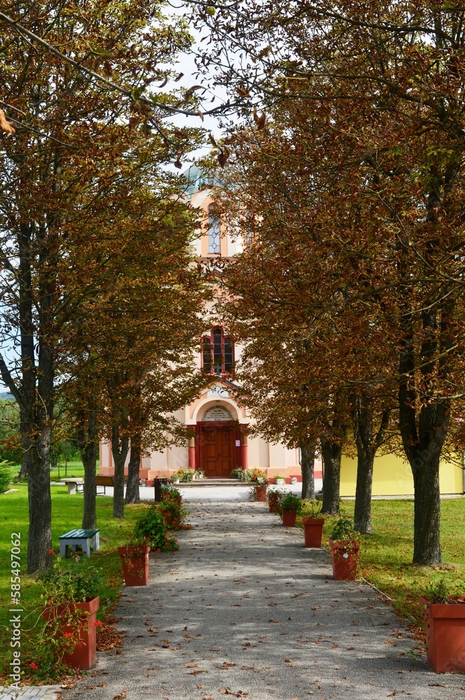 path and tree line towards the church