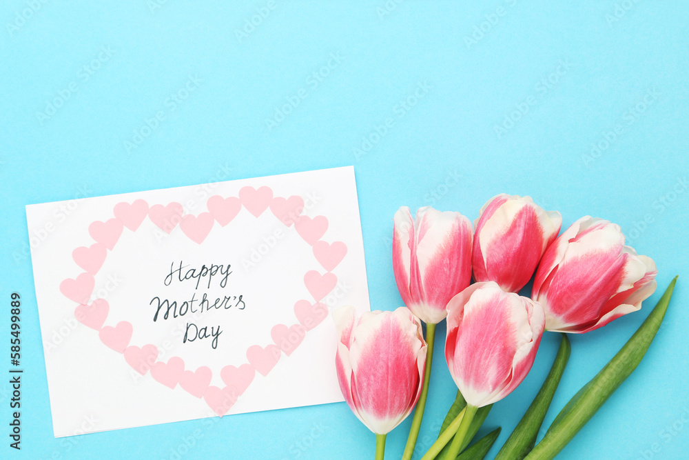 Text Happy Mother's Day with tulip flowers on blue background Text Happy Mother's Day with tulip flowers on blue background