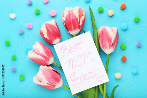 Text Best MOM Ever with tulip flowers on blue background