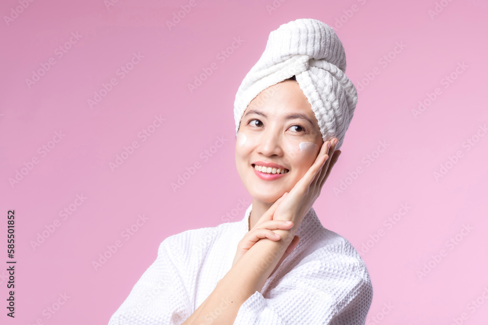 Young asian woman applying facial skincare face cream, cosmetic moisturiser on healthy natural skin make up face. Portrait glowing smile girl person model with care beauty product, spa, cosmetology. Young asian woman applying facial skincare face cream, cosmetic moisturiser on healthy natural skin make up face. Portrait glowing smile girl person model with care beauty product, spa, cosmetology.