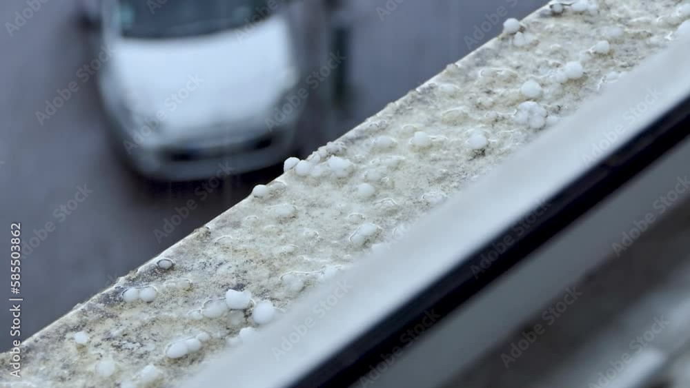 rain and hailstones on the edge of the window rain and hailstones on the edge of the window