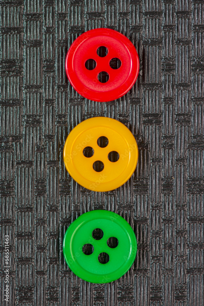 Red, yellow and green cloth buttons. Concept of traffic light. Red, yellow and green cloth buttons. Concept of traffic light.