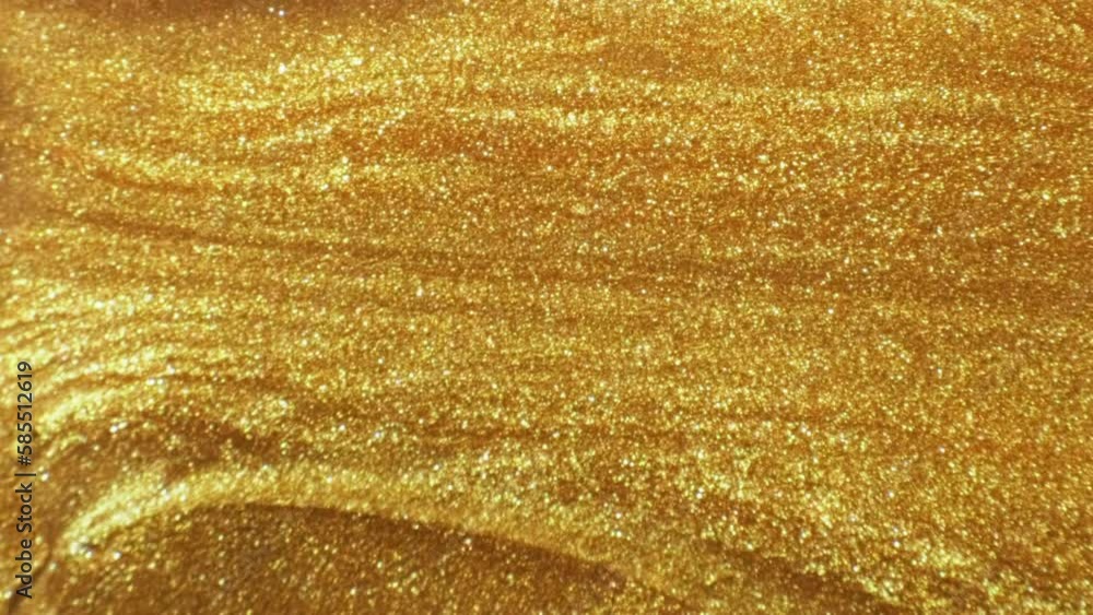 Shiny fluid. Molten gold. Ink flow. Defocused sparkling yellow color bubble glitter texture paint wave motion abstract background. Shiny fluid. Molten gold. Ink flow. Defocused sparkling yellow color bubble glitter texture paint wave motion abstract background.