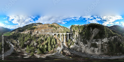 Seamless spherical HDRI aerial panorama 360 degrees for VR virtual reality of Landwasser Viaduct world heritage sightseeing Glacier express train railway landscape in Swiss Alps, Switzerland autumn. photo