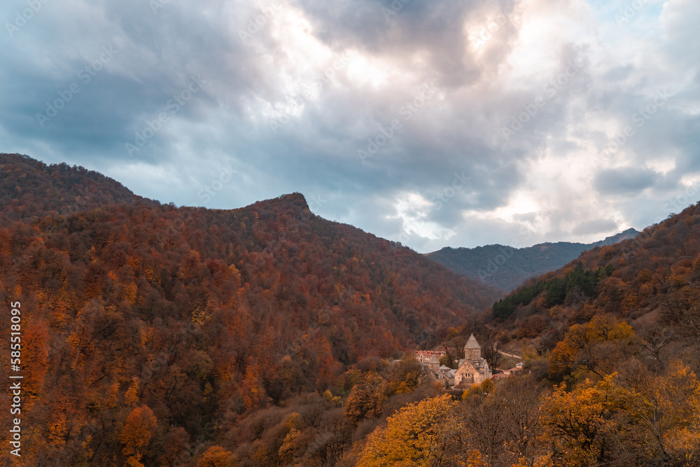 Ancient Monastery in the autumn forest.