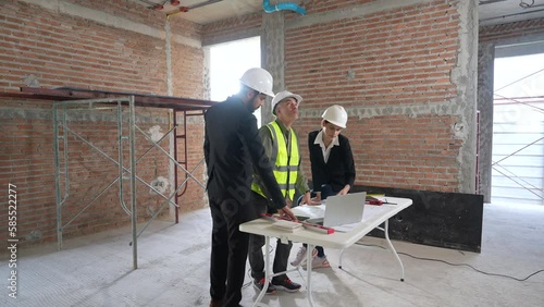 Team of experts or groups of civil engineers work together on a construction site.