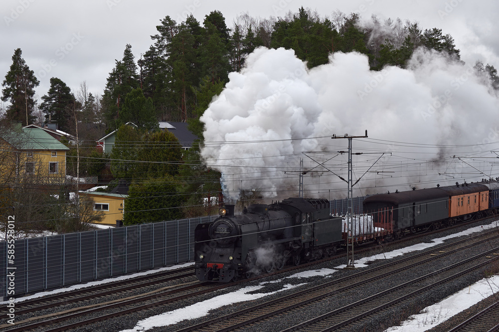 Obraz premium Arrival of old museum locomotive Ukko-Pekka in Finnish Kerava town.
