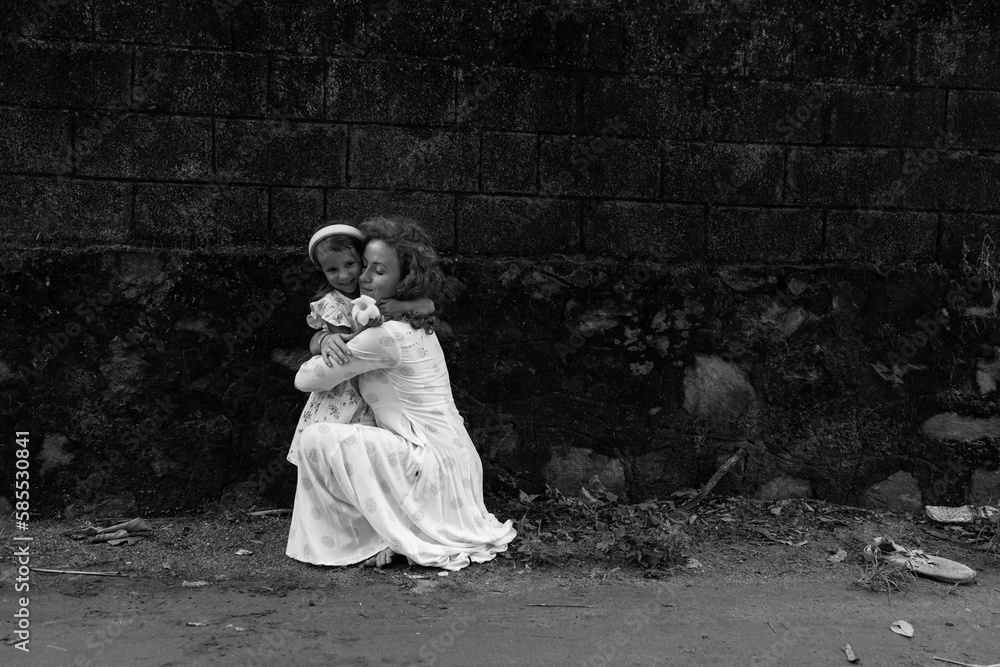 A mother hugs her little daughter with great love. The concept of family. Women in society. have fun with cute child baby girl 4-5 years old. Mommy little kid daughter. Motherhood.