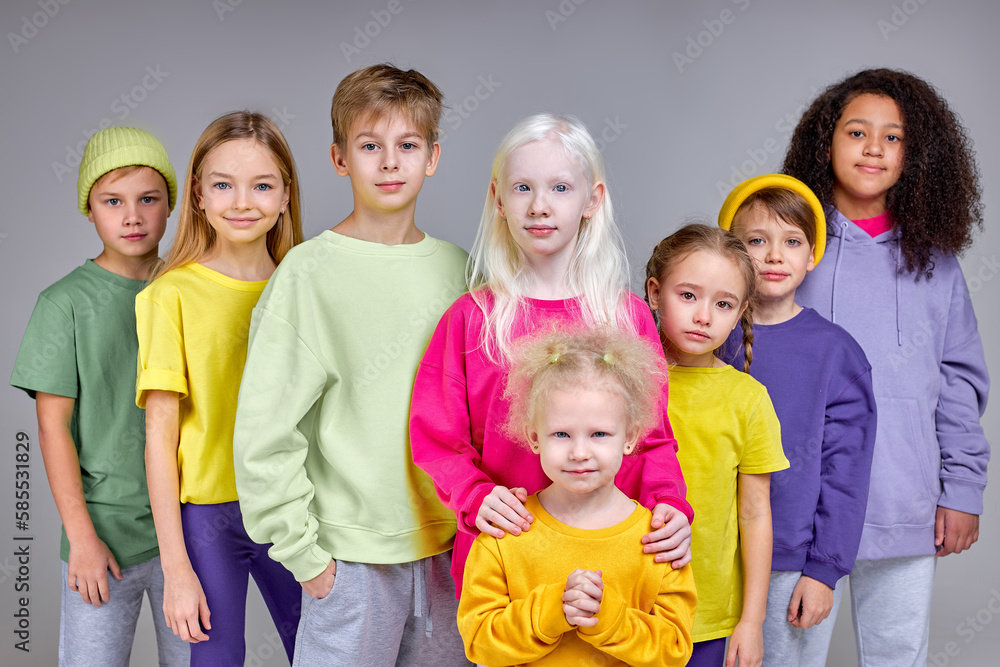 Group of children standing together, showing their unity, kids are against bullying, pedophilia isolated white background Group of children standing together, showing their unity, kids are against bullying, pedophilia isolated white background