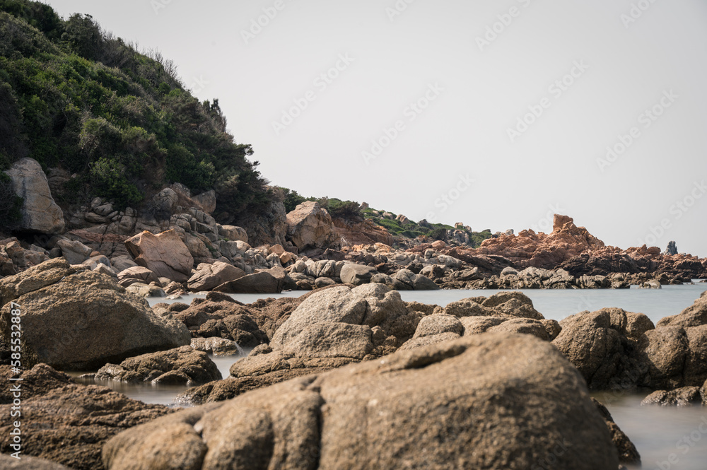 long exposure of rocks and sea on the coastline of the island Sardinia, Italy