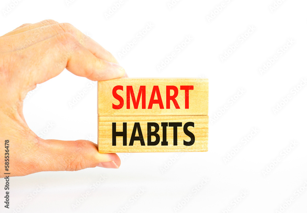 Smart habits symbol. Concept words Smart habits on wooden blocks. Beautiful white table white background. Businessman hand. Business and smart habits concept. Copy space. Smart habits symbol. Concept words Smart habits on wooden blocks. Beautiful white table white background. Businessman hand. Business and smart habits concept. Copy space.
