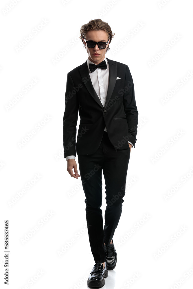 businessman putting one hand in pocket with badass walk businessman putting one hand in pocket with badass walk
