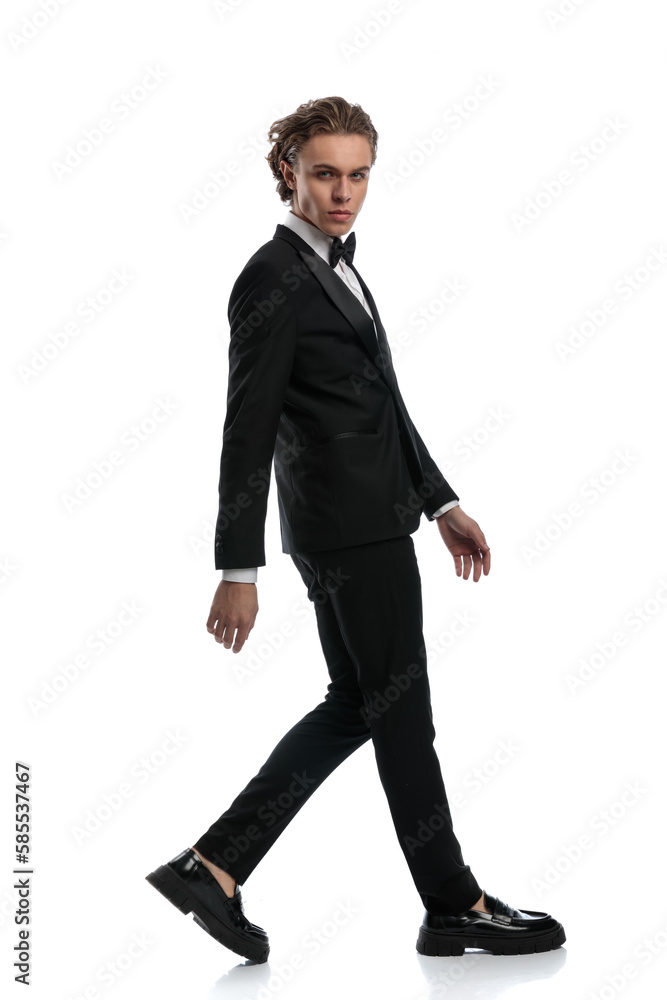 businessman walking to side and looking at camera businessman walking to side and looking at camera