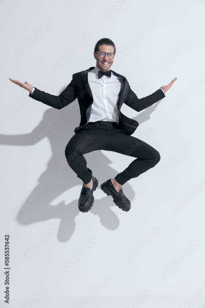businessman squatting in the air and laughing
