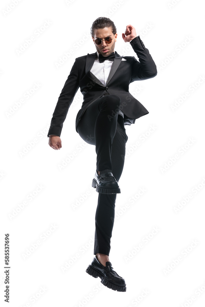 businessman posing with one knee up businessman posing with one knee up