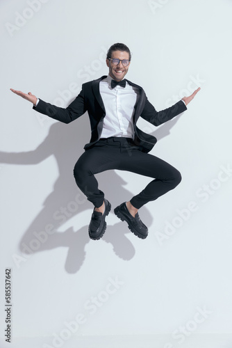 businessman squatting in the air and laughing