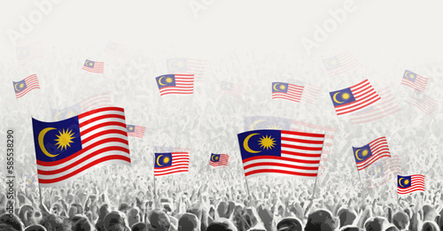 Abstract crowd with flag of Malaysia. Peoples protest, revolution, strike and demonstration with flag of Malaysia.