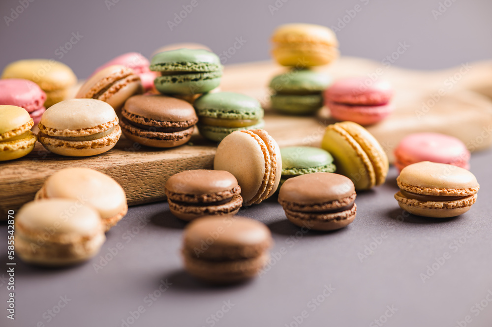 Sweet colorful macarons dessert on a gray background Sweet colorful macarons dessert on a gray background