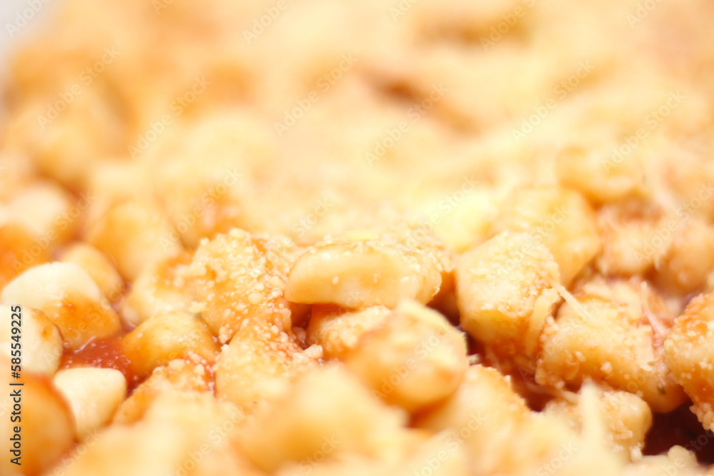 gnocchi prepared with red sauce with grated cheese. gnocchi with selective focus. Italian meal details. gnocchi prepared with red sauce with grated cheese. gnocchi with selective focus. Italian meal details.