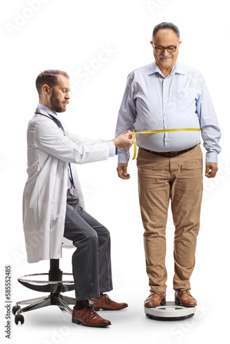 Doctor taking waistline measures from a mature man