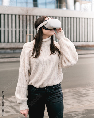 Girl using VR headset in the city