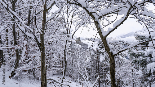Image of the Ancient/ Abbey of San Michele built on Mount Pirchiriano located at the entrance of the Susa Valley, around the years between 983 and 987 A.D. with an abundant snowfall