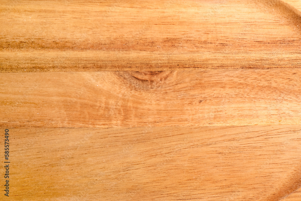 Fototapeta premium Wooden cutting board as background, closeup