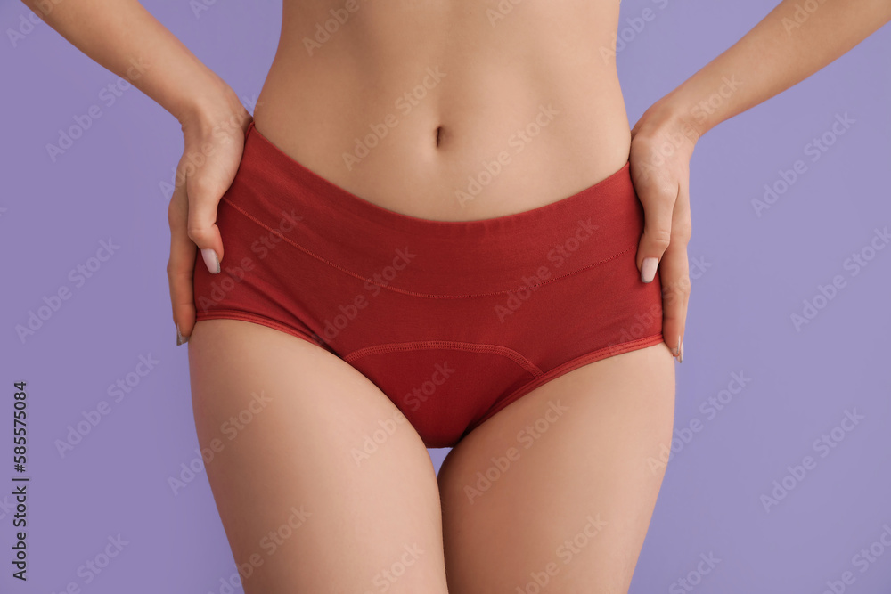 Young woman in menstrual panties on lilac background, closeup