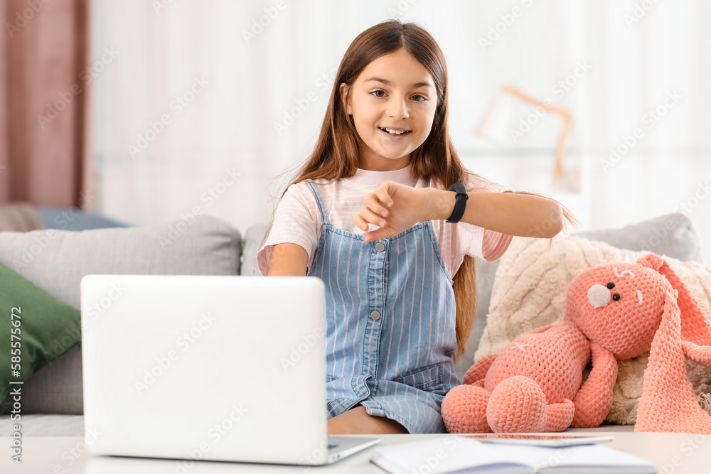 Little girl with smartwatch at home Little girl with smartwatch at home