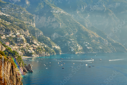 Panoramic view of Positano with comfortable beaches and blue sea on Amalfi Coast in Campania, Italy.