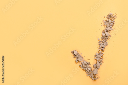 Check mark made of crumbled...