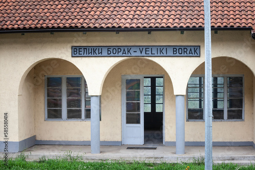 entrance to the train station of Veliki Borak, with the name of the village Veliki borak written in latin and cyrillic alphabet. it's a rural train station in the serbian countryside, in the area of K photo