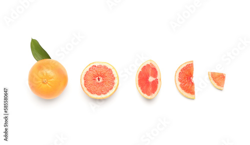 Fototapeta Naklejka Na Ścianę i Meble -  Composition with whole and cut grapefruits on white background